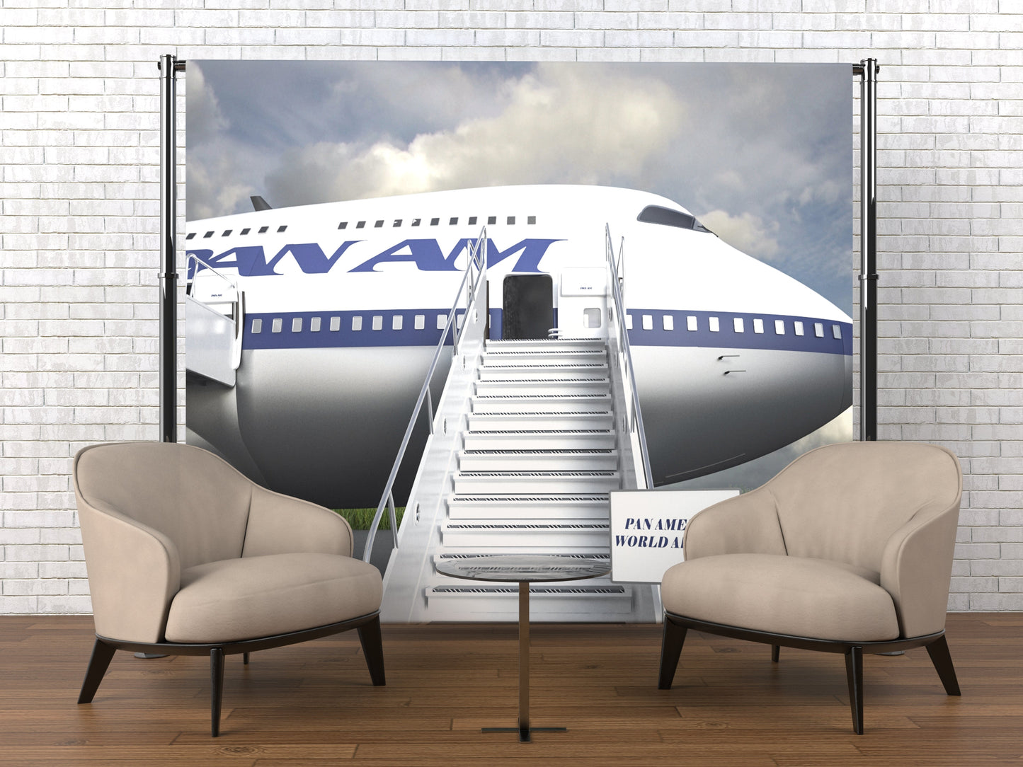 Two beige armchairs in front of a large poster of an airplane with KLM logo on a white brick wall.