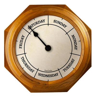 Wooden wall clock with days of the week display on a white background