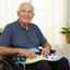 Elderly man in wheelchair with activity apron