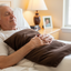 Man lying in bed Warming Body Pad