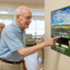 Senior man pointing at Cadillac wall sticker in memory care facility