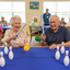 Seniors Playing Table Bowling - 5 Pins Per Side